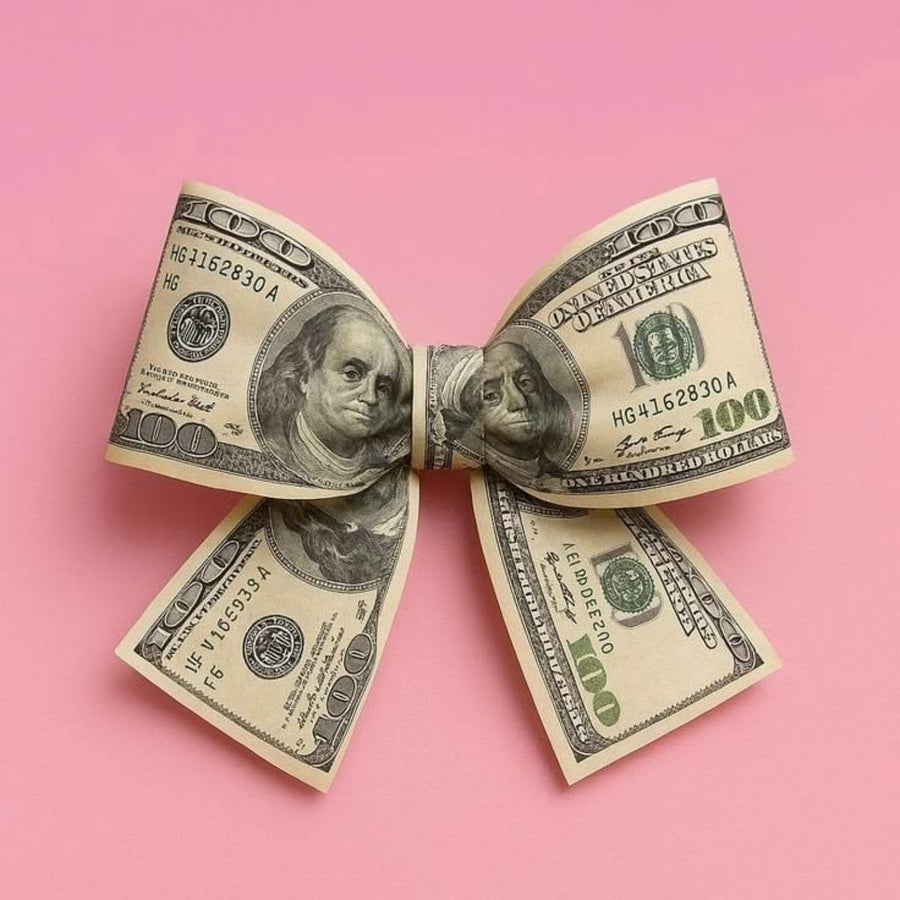 A bow folded from hundred-dollar bills on a pink background